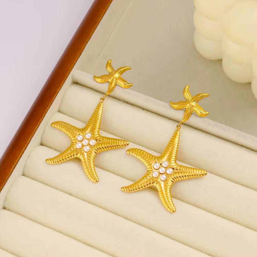 Gold starfish dangle Earrings with pearl detailing for women