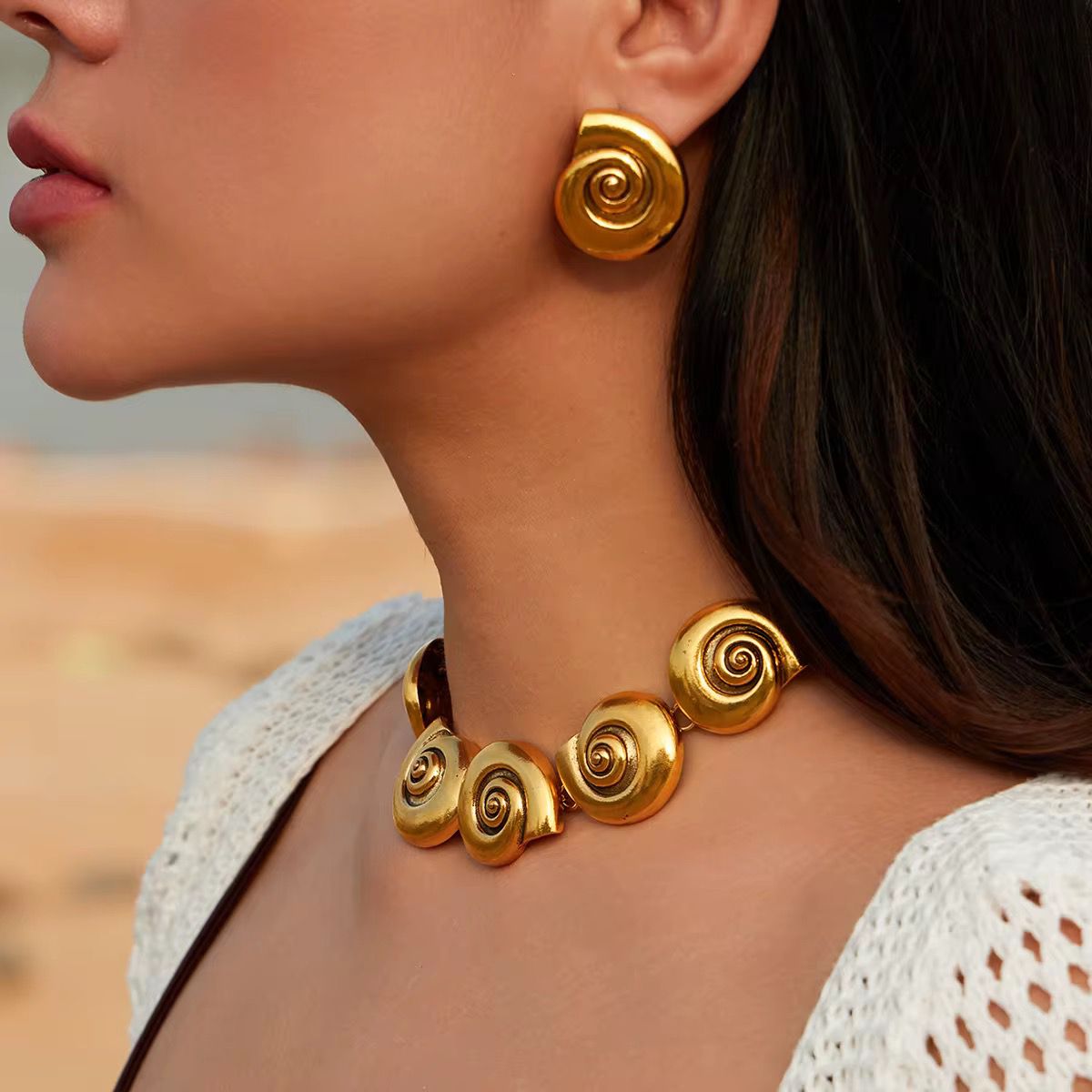 Gold spiral statement stud earrings for women