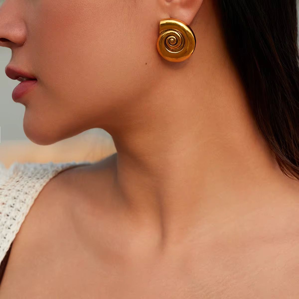 Gold spiral statement stud earrings for women